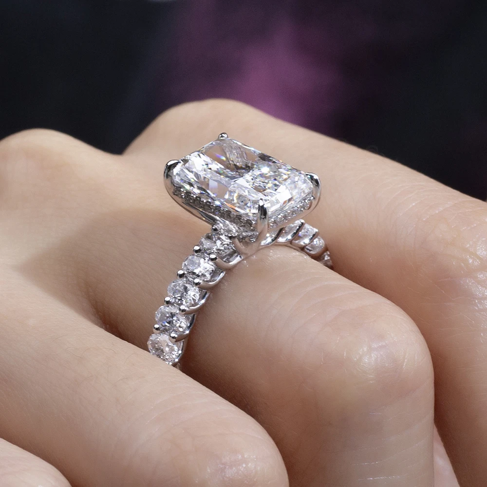 radiant cut moissanite ring white gold, pavé band engagement ring, white gold plated ring USA, lab grown diamond alternative, luxury engagement rings for women, moissanite jewelry India, modern bridal ring, statement ring for women